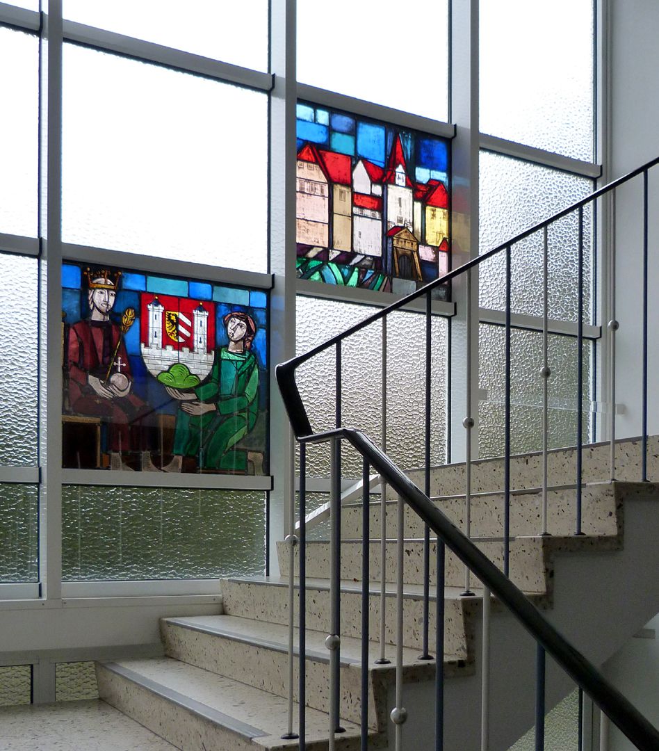 Stained glass windows on the city history Staircase to the first floor