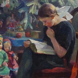 Girl reading in front of the Christmas tree